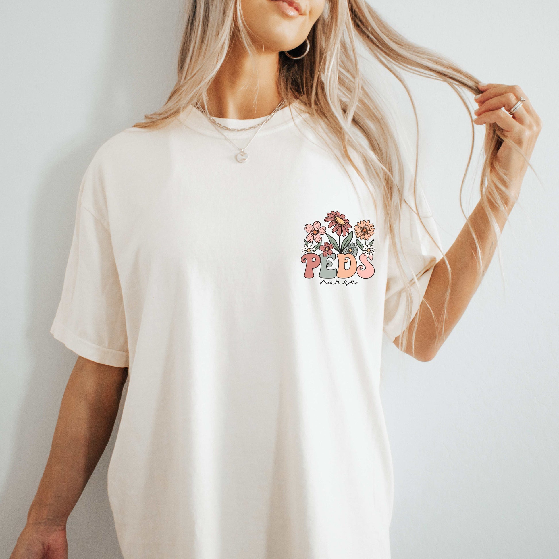 dBoldTees & DTF Transfers Peds w/ Nurse Floral Front Pocket & Back Design - Bella & Canvas Vintage White