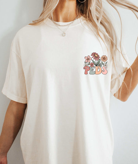 dBoldTees & DTF Transfers Peds (without "nurse" under pocket) Floral Front Pocket & Back Design - Bella & Canvas Vintage White (Copy)